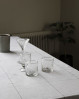 Lav et flot opdækket bord med en stilren grå dug fra House Doctor