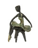 Metalfigur med en siddende ballarina. Speedtsberg figur der forestiller en ballarina, der sidder på en skammel