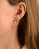 Elegante og klassiske creoler med et snoet design. Hana øreringe fra Pernille Corydon.